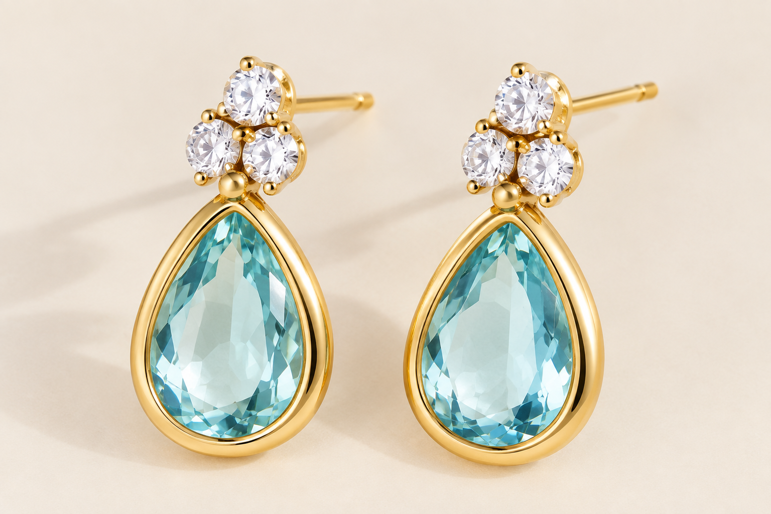 Aretes Bianca dorados con cristal azul en forma de lágrima - Aretes Victoria Secret para mujeres